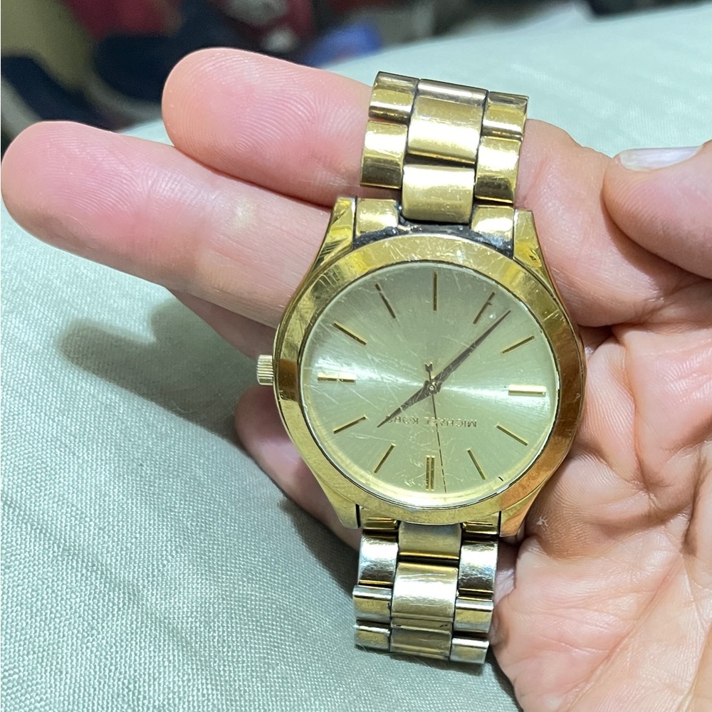 Michael Kors gold watch. Strong, classy. Face 1.5” around, some scratches.$150